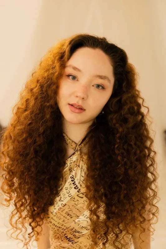 Before: natural curly auburn hair